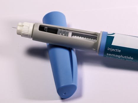 Detailed view of a semaglutide injection pen, commonly used for diabetes treatment, on a plain background.